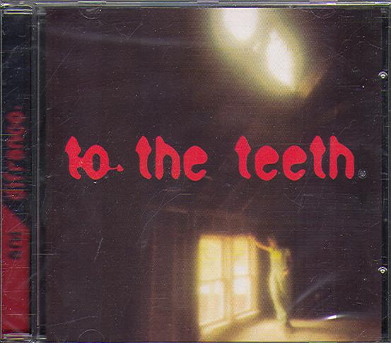 TO THE TEETH